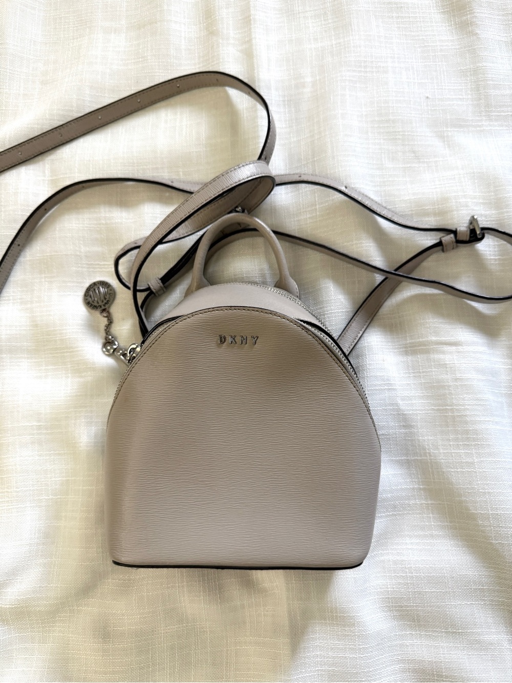 DKNY mini light gray backpack, silver hardware